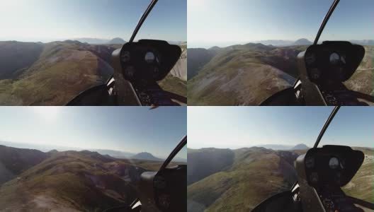 直升飞机在偏远的山区上空飞行高清在线视频素材下载