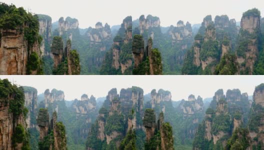 张家界山的石柱岩石构成覆盖热带森林高清在线视频素材下载