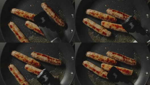 俯视图:牛肉香肠在平底锅里煎的时候被翻过来高清在线视频素材下载