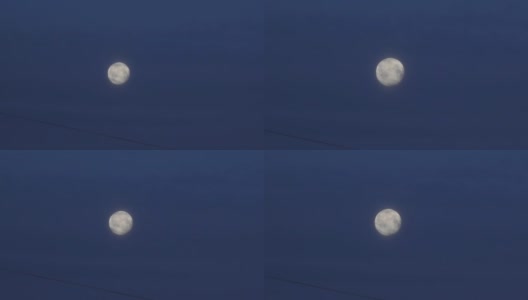一轮满月映衬着深蓝色的天空高清在线视频素材下载