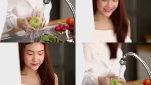 在厨房水槽里洗新鲜水果的女人高清在线视频素材下载