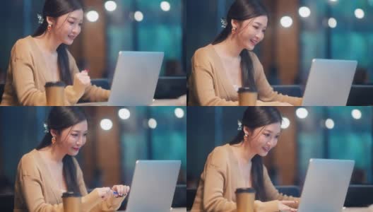 美丽的亚洲女人在休闲服装使用笔记本电脑工作电话视频会议高清在线视频素材下载