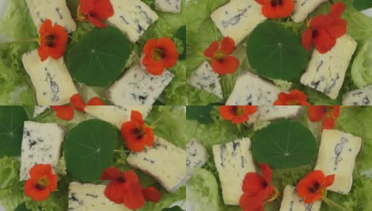 莴苣叶，蓝奶酪和可食用的旱金莲花高清在线视频素材下载