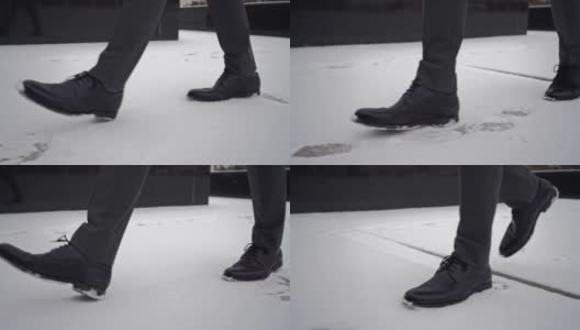 穿着黑鞋的商人。孤独的人走在雪城街道上高清在线视频素材下载