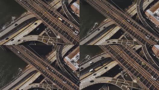 美国纽约鸟瞰图。无人机在东河岸边的交通路口上空飞行高清在线视频素材下载