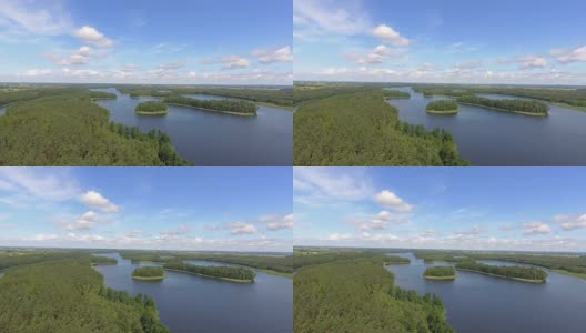 鸟瞰图绿色岛屿和云在夏天阳光明媚的早晨。波兰的马苏里安湖区。从上面看世界奇观。高清在线视频素材下载