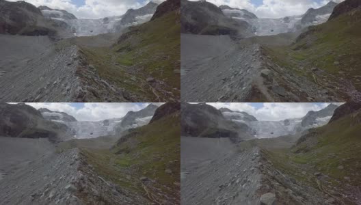 反向无人机拍摄的女子在瑞士的山脊上徒步旅行高清在线视频素材下载