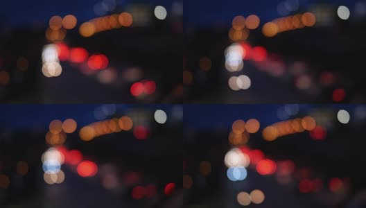 Bokeh市内夜间黑暗区域的交通状况高清在线视频素材下载
