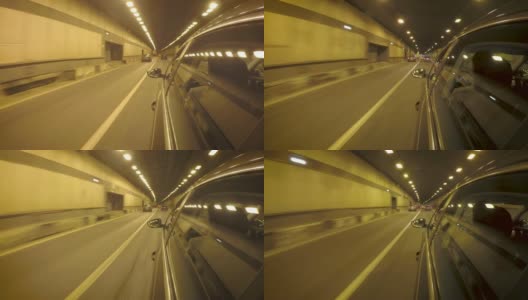 汽车在拥挤的交通中穿过隧道。从车身的侧视图高清在线视频素材下载