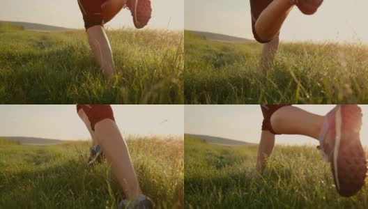 女跑步者在草地上奔跑的双腿高清在线视频素材下载
