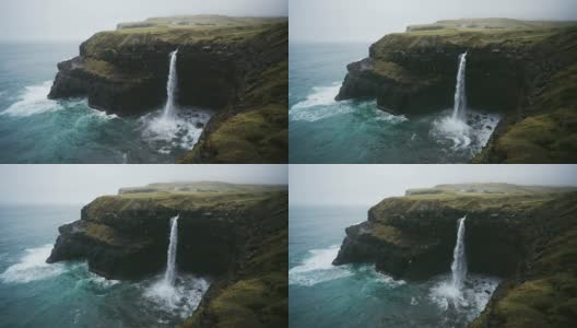在法罗群岛的风景Múlafossur瀑布坠入大海高清在线视频素材下载