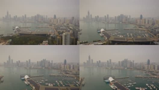 白天时间飞行青岛市区著名的奥林匹克湾水上交通航拍延时全景4k中国高清在线视频素材下载
