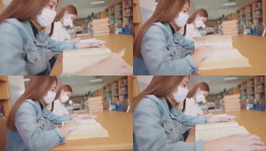 女大学生在大学图书馆看书高清在线视频素材下载