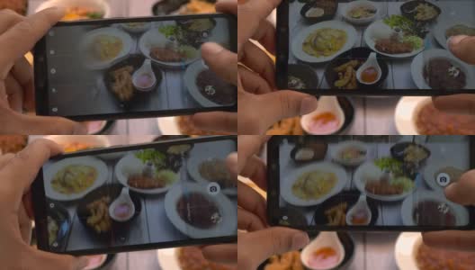 俯视图男子用智能手机拍摄餐盘上的食物高清在线视频素材下载