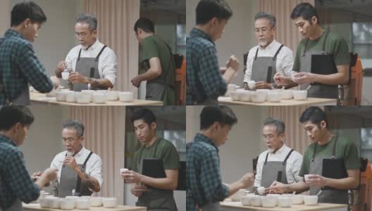 3亚洲华人男咖啡师拔火罐品尝咖啡品质饮用咖啡样品高清在线视频素材下载