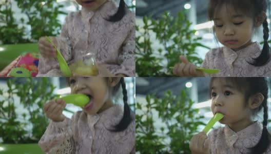 Adorable Little girl Eating Fruit高清在线视频素材下载