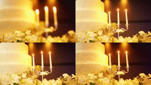 优雅的婚礼蛋糕装饰与蜡烛。高清在线视频素材下载