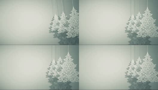 三棵圣诞树上的纸装饰品在摇摆高清在线视频素材下载