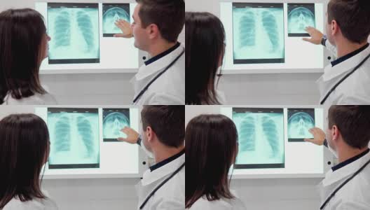 男医生向他的女同事解释x光高清在线视频素材下载