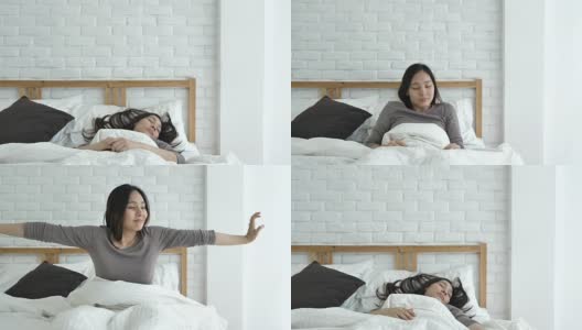 早上醒来后，女人在床上伸懒腰高清在线视频素材下载