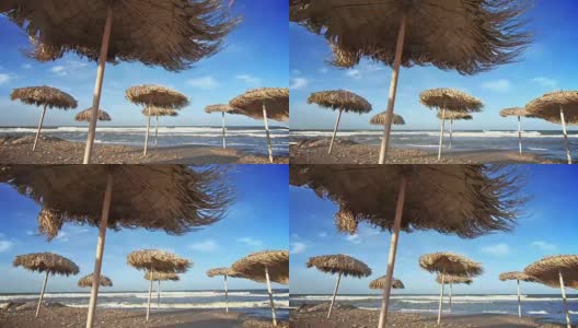 海边的草伞。高清在线视频素材下载