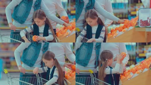 小女孩在果蔬超市选购橘子高清在线视频素材下载