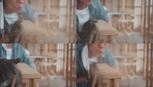 木匠在做木工活，在木板上吹灰高清在线视频素材下载