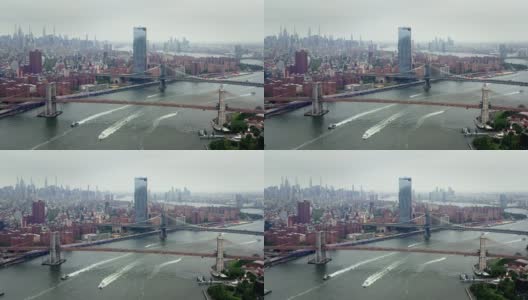 纽约的高楼大厦高耸入云。著名的无与伦比的城市在所有的荣耀。城市被河流包围。船在水面上。高清在线视频素材下载