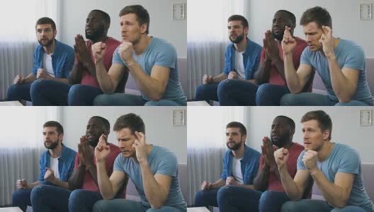 男人看体育比赛，祈祷团队获胜，迷信手势，希望高清在线视频素材下载
