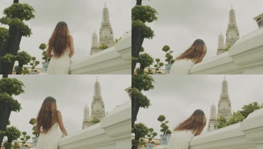 女人在曼谷看Wat Arun高清在线视频素材下载