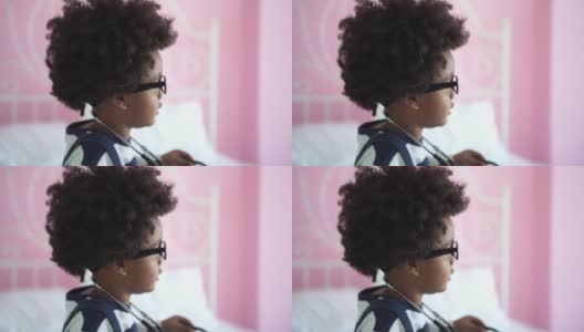 非裔美国小男孩试图戴眼镜和医用听诊器高清在线视频素材下载