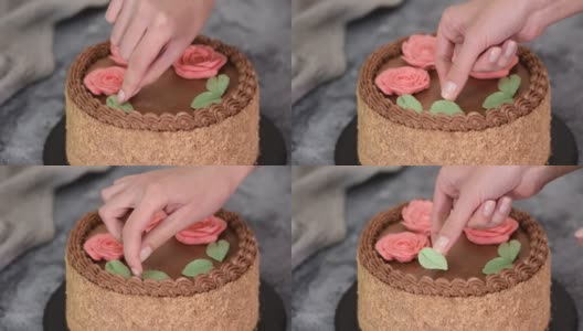 女性用奶油花和树叶装饰自制基辅蛋糕高清在线视频素材下载