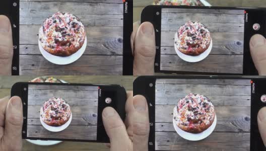 手拿智能手机和复活节蛋糕的照片高清在线视频素材下载