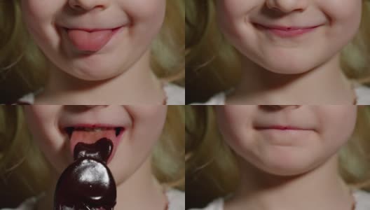 顽皮的十几岁的小女孩吃着，舔着从木勺里融化的巧克力糖糖浆高清在线视频素材下载