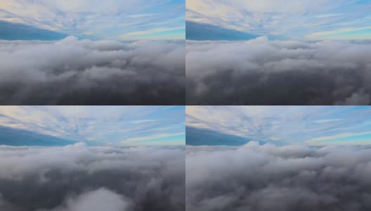 从高空俯瞰，在暴雨来临前，地面上覆盖着蓬松的雨云高清在线视频素材下载