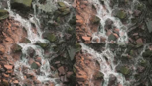 水缓缓地从岩石上倾泻而下高清在线视频素材下载