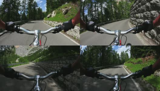 骑自行车下山的一条高山路高清在线视频素材下载