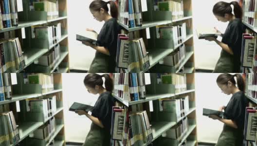 在图书馆看书的女人高清在线视频素材下载