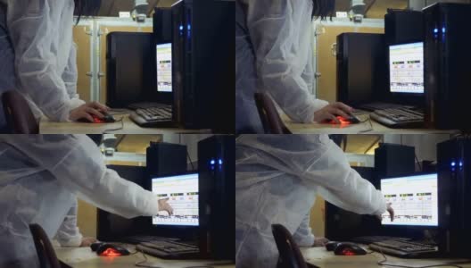 一名妇女在家禽养殖场的电脑里查看孵化器的信息高清在线视频素材下载