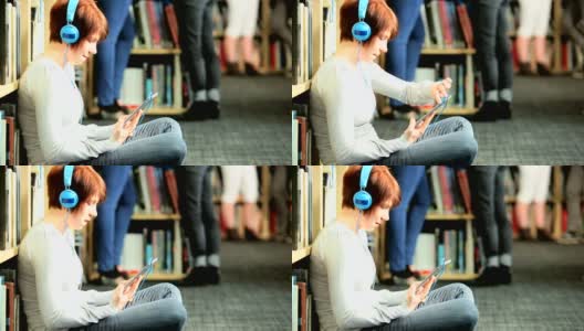 白人女性在图书馆学习在线教育高清在线视频素材下载
