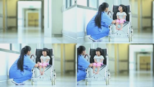 亚裔印度护士会说话的少数民族小女孩医院轮椅高清在线视频素材下载
