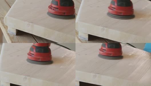 木匠打磨一个木制台阶与电动砂光机车间特写高清在线视频素材下载