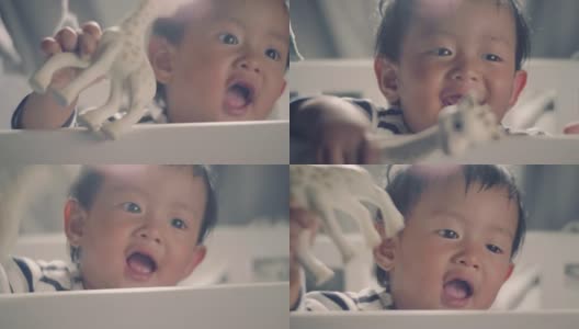 亚洲小男孩站在婴儿床上笑高清在线视频素材下载