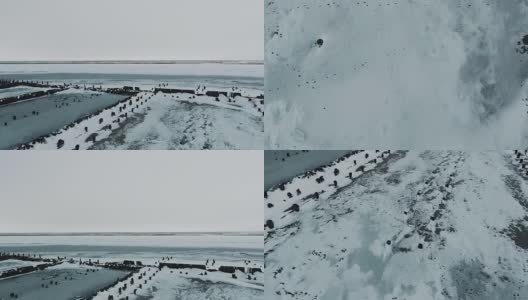 飞越湖。结冰的湖面上覆盖着一层厚厚的冰和雪。动物的痕迹高清在线视频素材下载