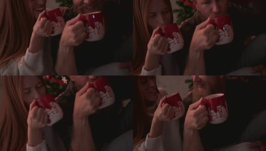 一对成熟的夫妇在圣诞节一起喝热巧克力高清在线视频素材下载