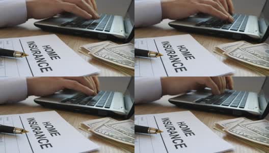 家庭保险表格和经理打字在笔记本电脑上。高清在线视频素材下载
