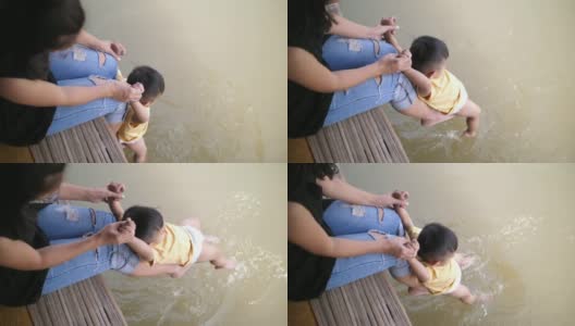 宝宝和妈妈在池塘边玩高清在线视频素材下载