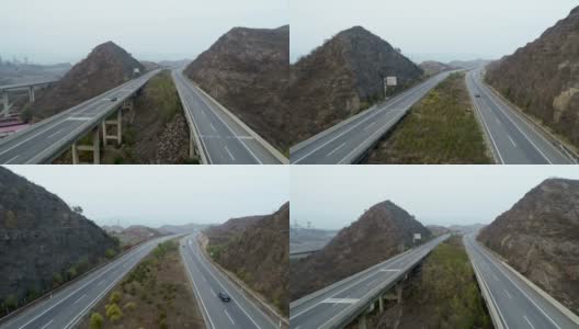 高速公路翻山越岭，汽车和卡车双向行驶高清在线视频素材下载