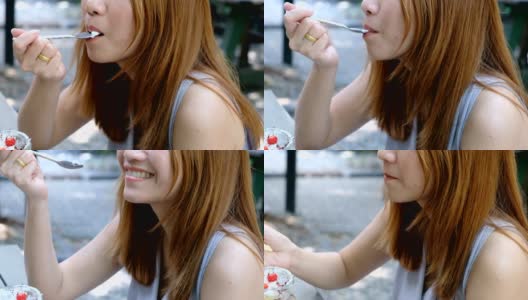 亚洲女人嘴的特写正在咖啡馆吃奶油蛋糕高清在线视频素材下载