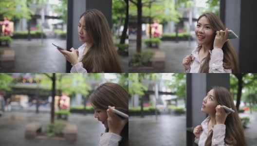 台湾妇女在街上发语音信息高清在线视频素材下载